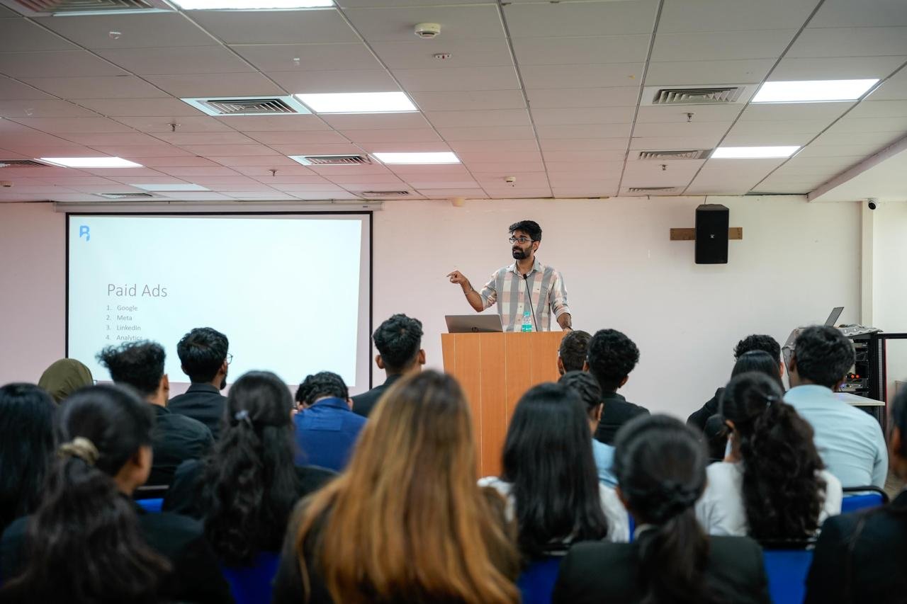 Shivam Singh, founder of WiseGuy XL, presenting on digital marketing on stage